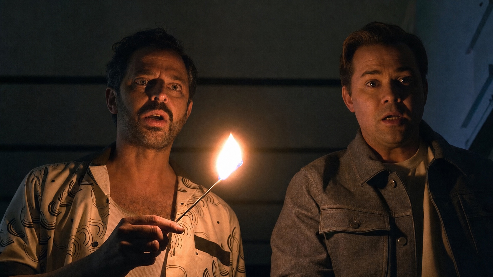 Nick Kroll and Andrew Rannells lit by a single match at night, I Don’t Understand You