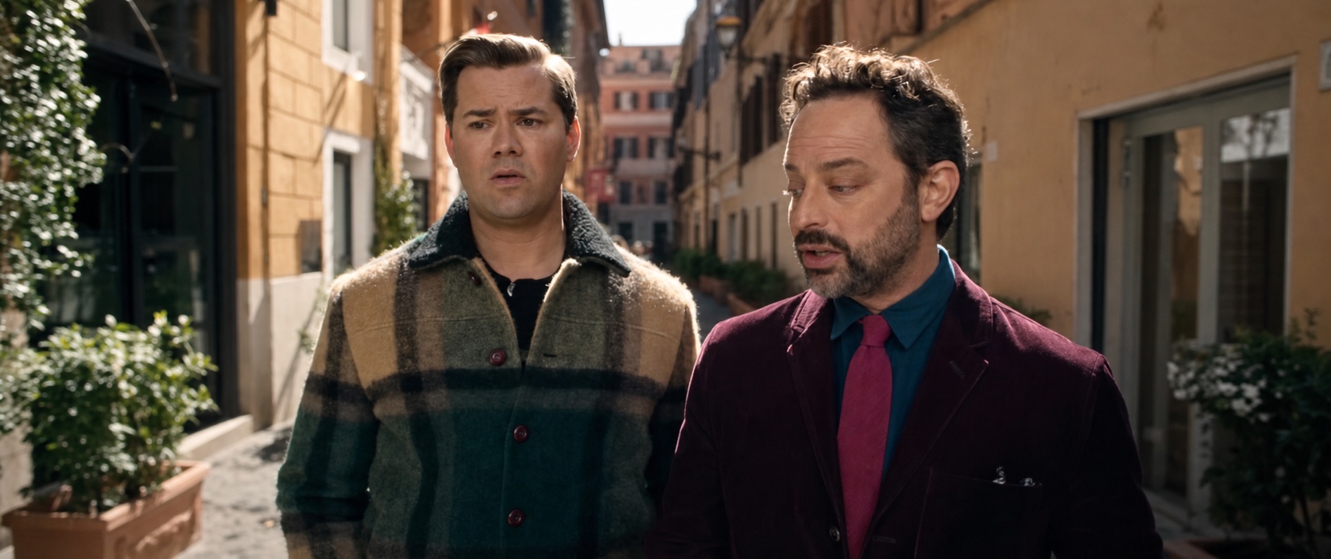Nick Kroll and Andrew Rannells walking an Italian street in autumn layers, I Don’t Understand You